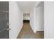 Inviting foyer with wood-look flooring offers views of the home's open living space at 519 Grass Fern Ct., Longs, SC 29568
