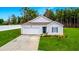 Charming single-story home features a manicured lawn, concrete driveway, and an attached one-car garage at 519 Grass Fern Ct., Longs, SC 29568