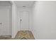Hallway with sleek floors and neutral walls provides access to bedrooms and bathrooms at 519 Grass Fern Ct., Longs, SC 29568