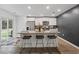 A sleek kitchen boasts stainless steel appliances, a breakfast bar, and stylish pendant lighting at 519 Grass Fern Ct., Longs, SC 29568