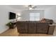 Cozy living area with plush sofa and large screen television is the perfect place to relax and unwind at 519 Grass Fern Ct., Longs, SC 29568