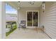 Inviting patio featuring outdoor grill, seating, and sliding glass door for easy indoor/outdoor living at 519 Grass Fern Ct., Longs, SC 29568