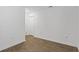 Bright, empty room features modern wood-look floors, baseboards, and neutral paint at 519 Grass Fern Ct., Longs, SC 29568