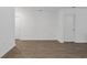 Empty room with neutral paint, baseboards, and modern wood-look floors at 519 Grass Fern Ct., Longs, SC 29568