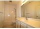 Bathroom featuring a large mirror, vanity sink, toilet, and tub with shower head at 528 Banks Dr. # 2-4 & 2-4G, Myrtle Beach, SC 29588