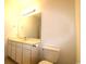 Bright bathroom featuring a large mirror, vanity, and toilet at 528 Banks Dr. # 2-4 & 2-4G, Myrtle Beach, SC 29588
