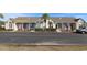Well-maintained townhome exterior with manicured landscaping, parking and charming front patios at 528 Banks Dr. # 2-4 & 2-4G, Myrtle Beach, SC 29588