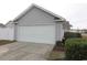 Detached garage with concrete driveway, white vinyl privacy fence and manicured landscaping at 528 Banks Dr. # 2-4 & 2-4G, Myrtle Beach, SC 29588