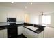 Well-equipped kitchen with modern appliances and a breakfast bar overlooking the living area at 528 Banks Dr. # 2-4 & 2-4G, Myrtle Beach, SC 29588