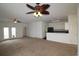 Open-concept living area with carpet flooring, french doors to the yard, and adjacent kitchen at 528 Banks Dr. # 2-4 & 2-4G, Myrtle Beach, SC 29588