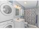 Upstairs bathroom with a stacked washer and dryer and white vanity at 6001-1086 S Kings Hwy., Myrtle Beach, SC 29575