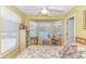 Bedroom features a bay window with a bookcase and a cozy elephant on the bed at 6001-1086 S Kings Hwy., Myrtle Beach, SC 29575
