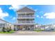 Three-story house with open decks on the 2nd and 3rd floors and parking and storage on the ground level at 6001-1086 S Kings Hwy., Myrtle Beach, SC 29575