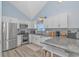 Modern kitchen features stainless steel appliances, granite countertops and white cabinetry at 6001-1086 S Kings Hwy., Myrtle Beach, SC 29575