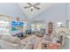 Comfortable living room with vaulted ceilings, light blue walls, and modern gray furniture at 6001-1086 S Kings Hwy., Myrtle Beach, SC 29575