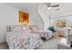 Bright bedroom with twin beds, coral-themed bedding, and a window overlooking the outdoors at 601 Gloucester Terrace Circle # 3C, Myrtle Beach, SC 29572