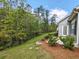 Backyard with mature trees creates a serene backdrop at 662 Sunnyside Dr. # 101, Murrells Inlet, SC 29576