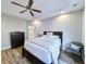 Comfortable bedroom features tray ceiling, ceiling fan, and ensuite bathroom access at 662 Sunnyside Dr. # 101, Murrells Inlet, SC 29576