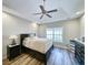Comfortable bedroom features dark furniture, ceiling fan and recessed lighting at 662 Sunnyside Dr. # 101, Murrells Inlet, SC 29576