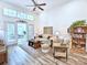 Cozy living room features high ceilings, French doors and neutral tones at 662 Sunnyside Dr. # 101, Murrells Inlet, SC 29576