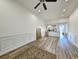 Spacious living room with hardwood floors, modern wainscoting and adjacent kitchen area at 662 Sunnyside Dr. # 101, Murrells Inlet, SC 29576