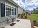 Comfortable patio seating area adjacent to the home, perfect for outdoor relaxation with pleasing landscaping at 662 Sunnyside Dr. # 101, Murrells Inlet, SC 29576