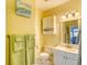 Well-maintained bathroom featuring a vanity, toilet, and linen storage at 670 Riverwalk Dr. # 304, Myrtle Beach, SC 29579