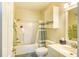 Bright bathroom featuring a shower-tub combo with tile surround and neutral decor at 670 Riverwalk Dr. # 304, Myrtle Beach, SC 29579