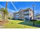 Brick apartment building with screened porches and well-maintained lawn at 670 Riverwalk Dr. # 304, Myrtle Beach, SC 29579