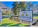 Community sign that reads Riverwalk on the Waterway; greenery surrounds the entrance at 670 Riverwalk Dr. # 304, Myrtle Beach, SC 29579