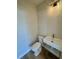 Chic half bathroom with a modern vanity, gold fixtures, and stylish lighting creating a sophisticated space at 713 9Th Ave. S, North Myrtle Beach, SC 29582