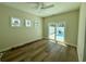 Bedroom featuring hardwood floors and a sliding door leading to a private pool area at 713 9Th Ave. S, North Myrtle Beach, SC 29582