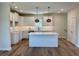 Newly built kitchen with shaker cabinets, a spacious island, stainless appliances, and modern pendant lights at 713 9Th Ave. S, North Myrtle Beach, SC 29582