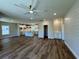 Open concept living space featuring luxury vinyl flooring, shiplap accents, and modern kitchen with a center island at 713 9Th Ave. S, North Myrtle Beach, SC 29582