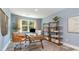 Stylish home office featuring a modern desk, comfortable chair, and bookshelves at 743 Plumage Ct., Myrtle Beach, SC 29588