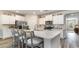 Stylish kitchen with white cabinetry, a kitchen island with seating, and stainless steel appliances at 743 Plumage Ct., Myrtle Beach, SC 29588