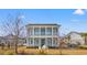 Two-story home featuring a double front porch with white columns and light blue siding, with minimal landscaping at 808 Crescent Sable Ct., Myrtle Beach, SC 29572