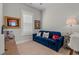 Comfortable living room with blue couch and neutral colored walls and carpet at 808 Crescent Sable Ct., Myrtle Beach, SC 29572