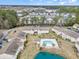 Aerial view of a community featuring a pool and lake at 8538 Hopkins Circle # E, Surfside Beach, SC 29575