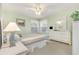 Cozy bedroom featuring a comfortable bed, natural light, and soft green walls for a relaxing atmosphere at 8538 Hopkins Circle # E, Surfside Beach, SC 29575