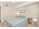Bright bedroom with a queen-size bed and a ceiling fan at 8538 Hopkins Circle # E, Surfside Beach, SC 29575