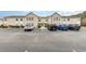 Exterior of condominium with ample parking including accessible parking at 8538 Hopkins Circle # E, Surfside Beach, SC 29575