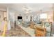 Inviting living room featuring tile flooring, a ceiling fan, and comfortable seating, perfect for relaxation and entertainment at 8538 Hopkins Circle # E, Surfside Beach, SC 29575
