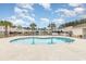Inviting community pool area with lounge chairs and palm trees at 8538 Hopkins Circle # E, Surfside Beach, SC 29575