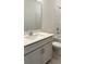 Bathroom vanity features light gray cabinets, a white countertop, and chrome faucet and hardware at 8639 Farrier Dr., Myrtle Beach, SC 29588
