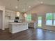 Bright, open kitchen with gray cabinets, quartz countertops, and stainless steel appliances at 8639 Farrier Dr., Myrtle Beach, SC 29588