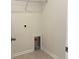 Functional laundry room featuring tile flooring, a wire rack, and dryer hookup at 8639 Farrier Dr., Myrtle Beach, SC 29588