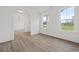 Open-concept living room featuring a view of the doorway and two windows at 885 Bear Lake Dr., Longs, SC 29568