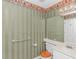 Bathroom with white vanity, toilet, and decorative wallpaper at 914 Hillside Dr. S # O, North Myrtle Beach, SC 29582