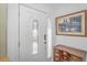 Bright and welcoming entryway with a decorative door, sidelight, and furniture at 914 Hillside Dr. S # O, North Myrtle Beach, SC 29582